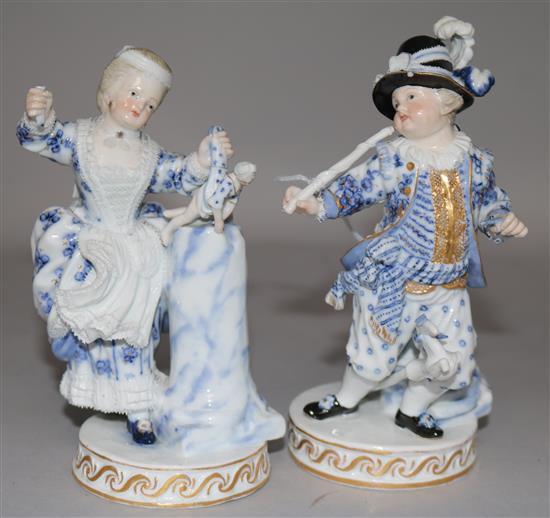 A pair of late Meissen blue, white and gilt figures of children (damage)